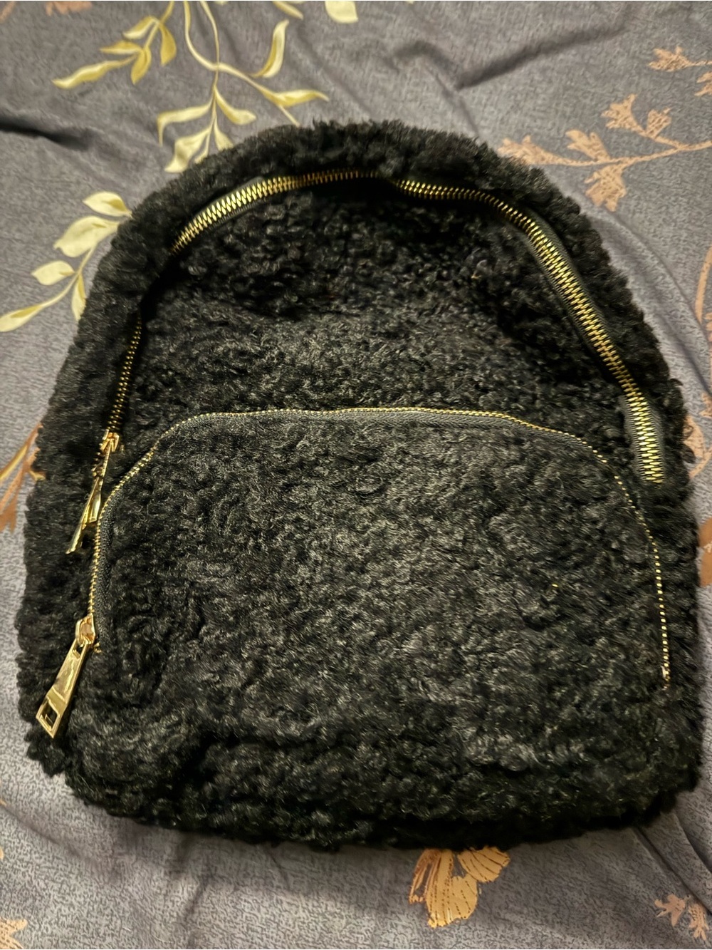 Cozy Black Faux-Sherpa Backpack with Gold Hardware